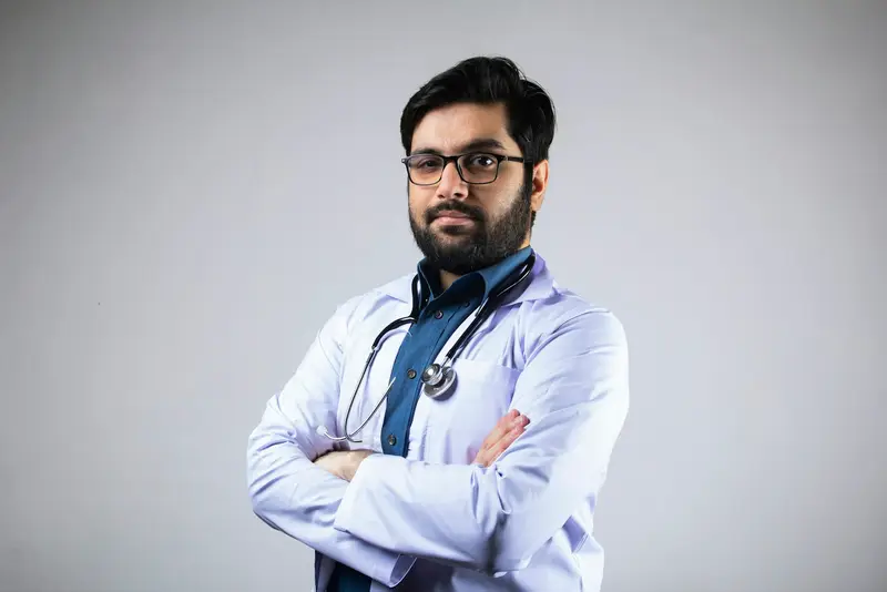 Portrait of a smiling dentist in a white coat