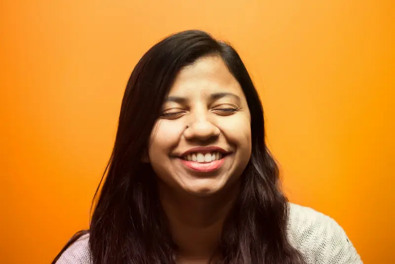 Young woman with a broad, confident smile