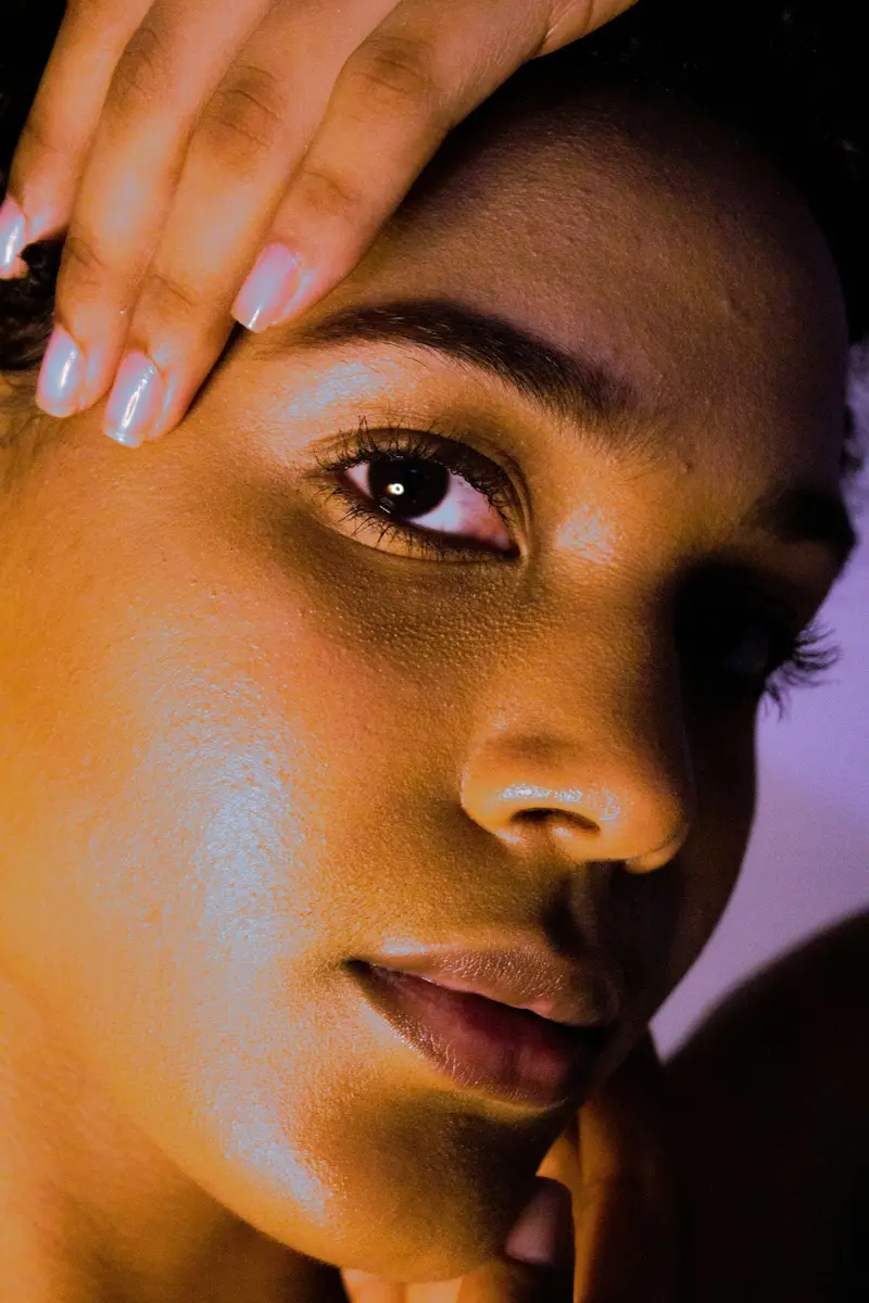 Close-up of a woman's even-toned, glowing skin
