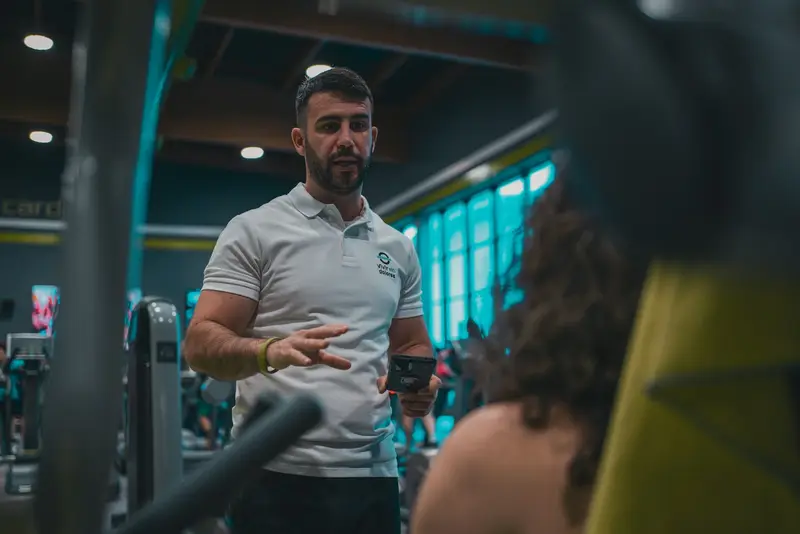 Personal trainer on the gym floor