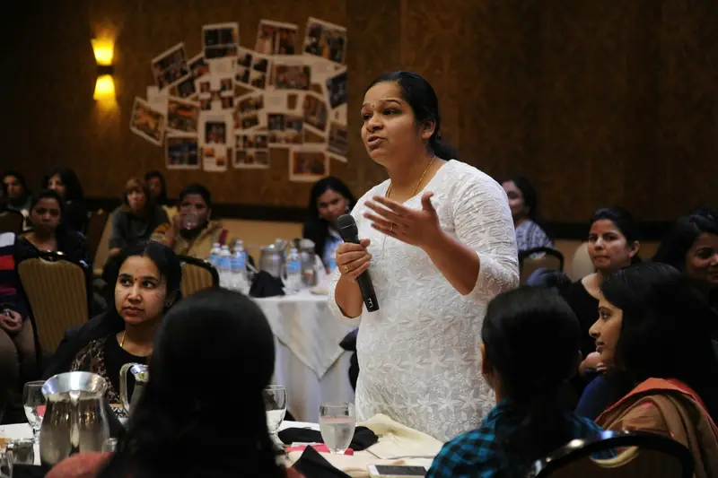 Teacher explaining a concept to a group of students